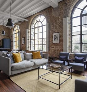 Warehouse loft living room with arched windows